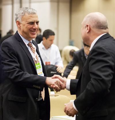 Menahem Anderman AABC 2014 handshake with Steve Clark